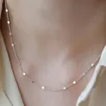 Close-up of minimalist titanium steel necklace with flat link details on neck skin. - 40+5cm / Polished Curb Chain / Silver