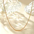 Detailed close-up of an elegant golden titanium steel rope chain necklace - 40+5cm / Fine Braided Chain / Gold