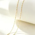 Detailed close-up of elegant gold-toned stainless steel lips chain necklace on stand. - 40+5cm / Gypsophila / Gold
