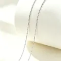 Close-up of a minimalist silver-colored sparkling stainless steel necklace chain. - 40+5cm / Gypsophila / Silver