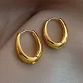 Chic gold-finished copper hoop earrings with a smooth polished rounded oval design - Shiny Gold Oval Hoop (5933101)