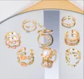 Elegant vintage gold-plated multi-piece ring set featuring snake pearl and heart designs - 5929201