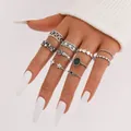 Retro silver heart and star ring set with black accents worn on hand with white nails - 5910601