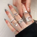 Vintage silver heart ring set for women featuring spade and minimalist cutout designs. - 5604301