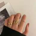 Elegant 7-piece gold knuckle ring set featuring mixed chain and minimalist band styles - One Size / Gold Wave Hollow Chain 5-Piece Set (5282101)