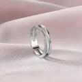 Macro view of a minimalist double-layer titanium steel ring with delicate pavé stones - US 5 / Silver