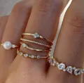 Elegant gold stacking ring set featuring pearls and sparkling rhinestones for women - Gold Artificial Pearl Multi-Shape Rhinestone Ring 7-Piece Set (6466501) / Gold