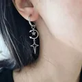 Gothic punk silver stainless steel crescent moon and star dangle hoop earring shown on ear - Crescent Pentagram Star Drop Earring (11848)