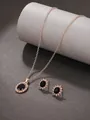 Detailed macro shot of baroque royal jewelry set with black sunflower earrings and necklace - Rose Gold Black M-145 (2-Piece Set)