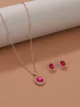 Elegant rose gold necklace and sunflower earring set with vibrant red oval stones. - Rose Gold Rose Red M-149 (2-Piece Set)