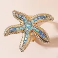Bague étoile de mer dorée élégante ornée de strass étincelants bleus et transparents - Bague Étoile de Mer Strass Bleu Dégradé (WR1144) / Plaqué Or