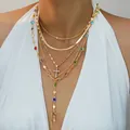 Juego de collares dorados multicapa con dijes de gemas de colores y colgante de cruz brillante. - 6603401hb / Collar