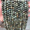Perles rondes en pierre turquoise d'Afrique naturelle pour la création de bijoux DIY - Perles de turquoise africaine naturelle / 12mm/Env. 31pcs