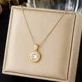 Detailed view of a gold-plated compass pendant necklace with shimmering zircon stones - Radiant Compass Zirconia Inlaid Necklace (N4543)