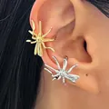 Macro view of gothic spider ear cuffs in gold and silver finish worn on ear lobe - 2 Pcs/Set / Silver and Gold