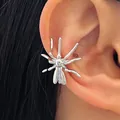 Detailed macro view of a silver spider-shaped Halloween ear cuff on a human ear - Spider Style (12445) / Silver