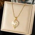 Elegant detail view of a vintage gold-plated heart pendant necklace with pink enamel - Pink Heart Enamel Radiant Pattern Pave (N4528)