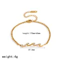 Goldfarbenes Edelstahlarmband in Wellenform mit Zirkonia und Größenangaben. - Wellenförmiges Zirkonia-Armband (TB5282)