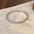 Elegante bracciale rigido argento con due file di strass iridescenti scintillanti - Strass AB / Argento