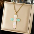 Detailed macro view of colorful enamel cross pendant on a gold-plated stainless steel chain. - White Pink Green Enamel Cross Style (N4523)