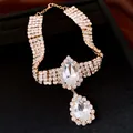 Exquisite detail view of sparkly rhinestone choker necklace with large waterdrop crystal pendants - Gold