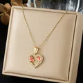 Detail view of gold-plated heart pendant with rhinestones and pink enamel accents. - Hollow Heart Pink Enamel Pave Style (N4553)