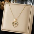 Exquisite gold-plated stainless steel heart pendant with sparkling rhinestone inlay - Hollow Heart Black Enamel Pave Style (N4554)