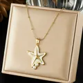 Detailed macro view of gold-plated starfish pendant necklace with white inlay and pearls - White Sea Star Artificial Pearl Inlaid Style (N4524)