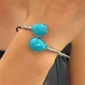 Close-up of vintage silver cuff bracelet featuring teardrop turquoise stones with vein details. - Teardrop Inlay Style (DZ-392) / Antique Silver (DZ-392)