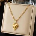 Detailed view of a gold-plated 3D grape pendant necklace on a jewelry display box. - 3D Bead Grape Style (N4543)