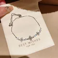 Detailansicht eines silbernen Kleeblatt Armbands mit Zirkonia und verstellbarem Verschluss - Vierblättriges Kleeblatt Katzenaugen-Stil (44#)
