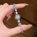 Elegantes silberfarbenes Armband mit blauen Kleeblättern und funkelnden runden Zirkonia - Vierblättriges Kleeblatt Blaues Motiv-Stil (65#)