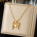 Close-up of gold-plated butterfly pendant necklace with rectangular crystal detail. - Square Zirconia Hollow Butterfly Paperclip Chain (N4535)