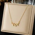 Close-up of 18K gold plated stainless steel olive branch necklace with zirconia - French Pave Olive Branch Style (N4544)