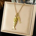 Macro detail of gold stainless steel necklace with double fish pendants on jewelry box - Creative Gradient Enamel Double Fish Pendant (N4527)