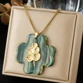 Vintage flower pendant necklace featuring elegant leaf detail and marbled ink wash texture - New Chinese Style Ink Pattern Four Petal Flower Pendant (N4560)