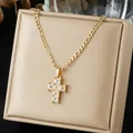 Close-up of gold-plated stainless steel cross pendant set with clear stones on a display box - Full Pave Cross Square Zirconia Style (N4540)