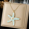 Gold-plated starfish pendant necklace with blue enamel detail on a beige jewelry box - Light Blue Sea Star Enamel Gold Chain (N4555)