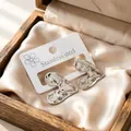 Orecchini a bottone a cuore irregolari in acciaio inossidabile finitura argento - Cuore Piatto / Colore acciaio