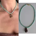 Collana di perle turchesi con ciondolo a conchiglia marrone per la spiaggia - Collana con Conchiglia Nera e Perle Tonde Turchesi
