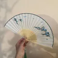 Elegant Suzhou embroidery folding fan with mountain landscape pattern and green tassel - Landscape Painting