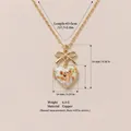 Collana medaglione cuore vintage con illustrazione angelo e fiocco dorato in rame - Pendente Medaglione Cuore Fiocco Angelo / Oro