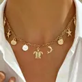 Elegant gold Bohemian beach necklace featuring sea turtle, starfish and faux pearl charms. - Marine Creature Pendant Metal Necklace (5591)
