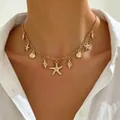Bohemian gold necklace featuring delicate starfish and seashell charms for beach wear - Bohemian Marine Pendant Clavicle Chain (5632)