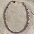 Macro detail of a handmade necklace featuring purple natural stones and delicate pearls. - Necklace 8 (38+5cm)