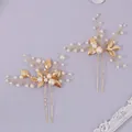Elegant handmade gold bridal hair pin set featuring white pearls and delicate metal leaves - Photogenic Hair Sticks Set of 2 HS-J7403G