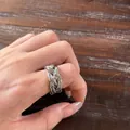 Elegant silver braided woven statement ring for women shown on a wooden background - Braided Twisted Open Ring / Silver