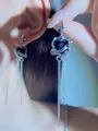 Elegant silver-toned long tassel ear clips with black heart gem and star motifs - Black Heart Long Tassel Earring Style (Pair) (DZ-847) / Silver