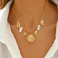 Collana da spiaggia boho con stelle marine dorate, ciondoli a conchiglia e perle. - Collana con Stella Marina a Tema Oceano (1666)