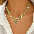 Collana bohémien con stelle marine, conchiglie e perle finte, perfetta per la spiaggia. - Collana con Pendente a Perline Bohémien Oceano (6375)